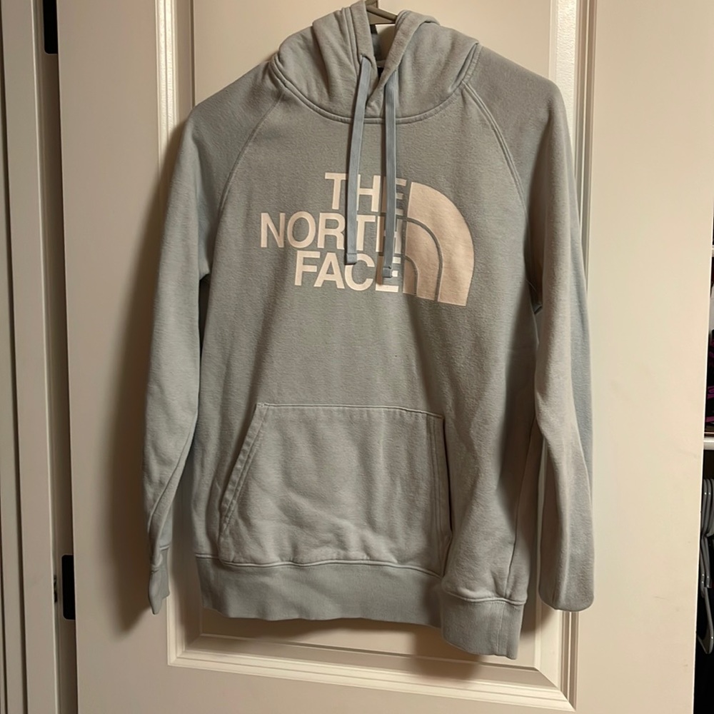 light blue north face jacket